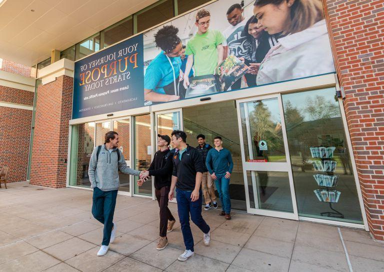 students walk outside the DUC